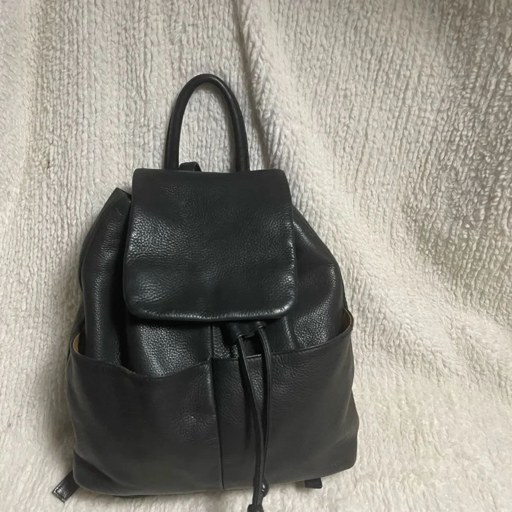 Tignanello Leather Black small Backpack string straps closure.